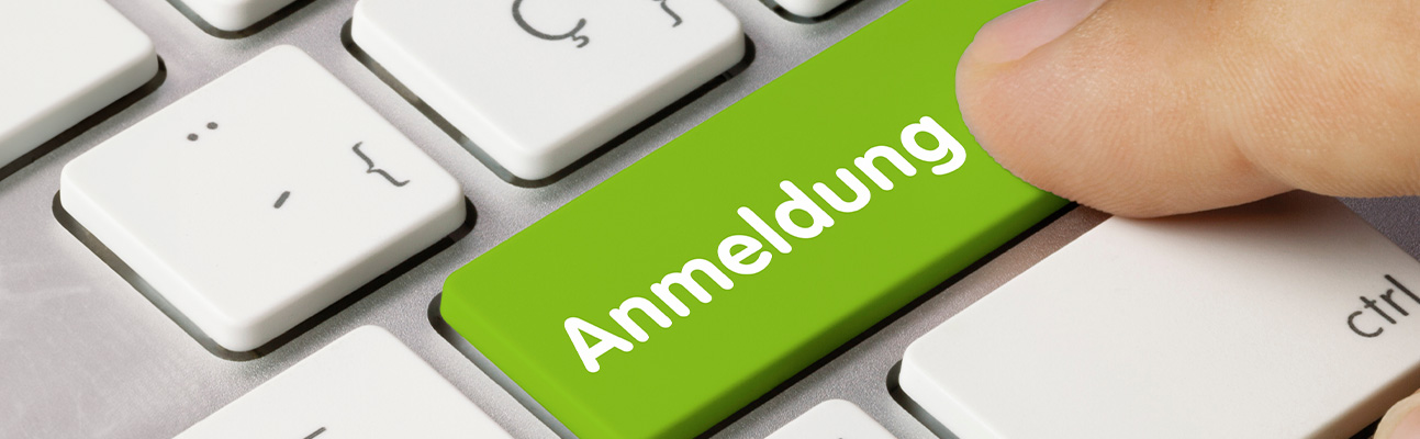 Tastatur mit grüner Taste, auf der das Wort Anmeldung steht